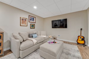 FINISHED LOWER LEVEL The finished walk-out lower level offers exceptional versatility with a spacious recreation room, dedicated fitness room, and generous storage areas to keep everything organized.