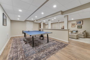FINISHED LOWER LEVEL The finished walk-out lower level offers exceptional versatility with a spacious recreation room, dedicated fitness room, and generous storage areas to keep everything organized.