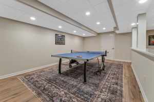 FINISHED LOWER LEVEL The finished walk-out lower level offers exceptional versatility with a spacious recreation room, dedicated fitness room, and generous storage areas to keep everything organized.