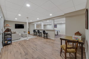 FINISHED LOWER LEVEL The finished walk-out lower level offers exceptional versatility with a spacious recreation room, dedicated fitness room, and generous storage areas to keep everything organized.