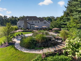 SALTWATER POOL Custom Heated Saltwater Pool with Travertine Coping And Patio Surround/Natural Stone Waterfall/Custom Slide/Pennsylvania Moss Rock Diving Stone. Polaris Aqua Plus Robotic Pool Cleaner (included).