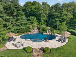 PATIO/POOL Completing the private backyard oasis is a heated saltwater pool with a custom pool slide, offering the ultimate resort-style experience right at home.