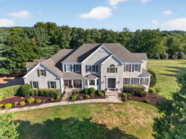 FRONT ELEVATION Welcome to a home where luxury and exceptional design come together. 4,223 Sq Ft of beautifully appointed living space plus a finished walk-out lower level.