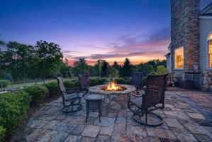 PATIO/STONE FIREPIT A sprawling stone patio with stone firepit creates the perfect setting for relaxing