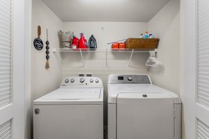 Laundry closet with shelving