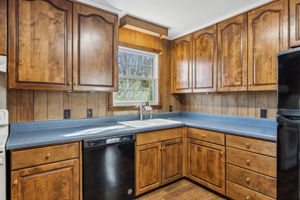 Custom wood cabinets and all appliances stay