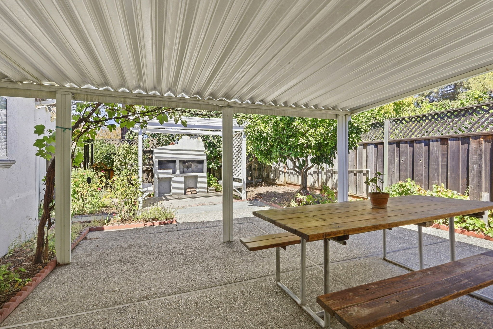 View of Magnificent Custom Pergola & European Style Wood Fired Pizza Oven from Family Room