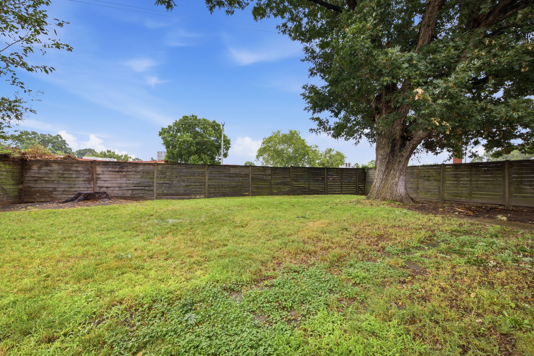 spacious, fully fenced back yard