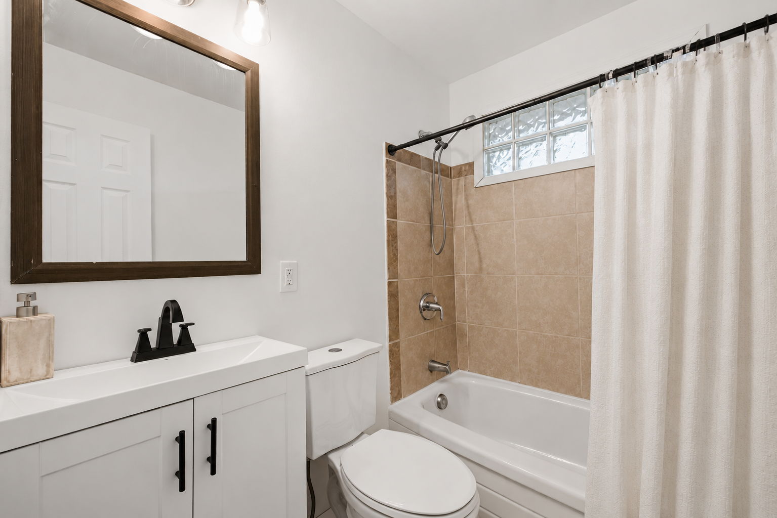 refreshed bathroom with tiled shower