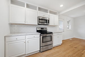 Painted cabinetry with granite countertops