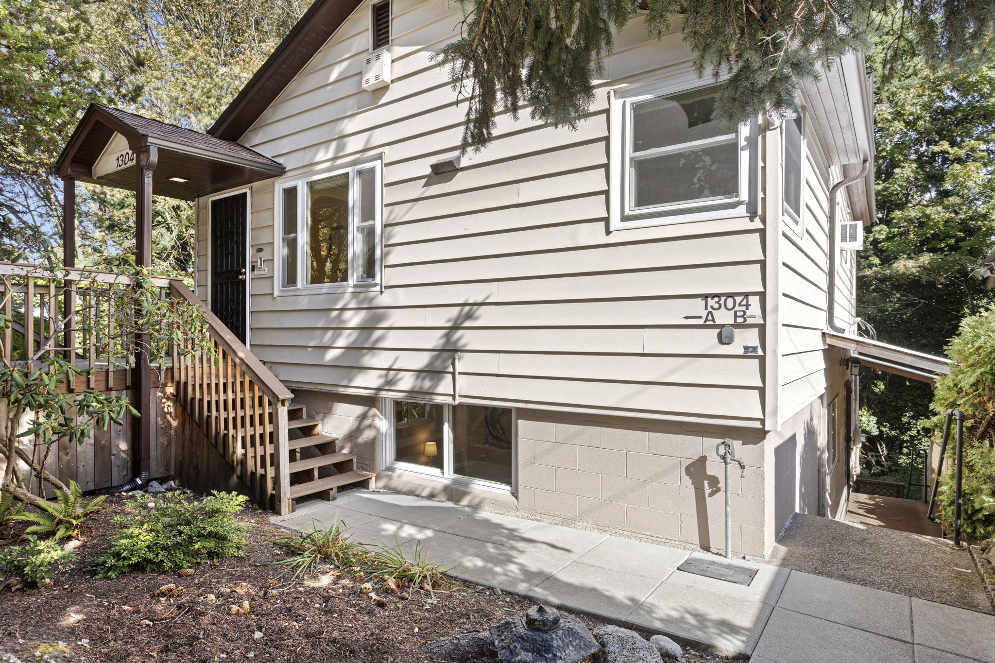 The layout supports multi-generational living or shared arrangements—each unit has its own entrance, with thoughtful separation and natural connection between them. Private. Peaceful. Parkside. This 1-bedroom upper unit offers a refreshed kitchen, spacious living room, and treetop views into Lewis Park. With its own entrance and calm, leafy surroundings, it’s well-suited as a main residence, a comfortable guest space for visitors or extended family, or a potential short-term rental—if desired and permitted.
