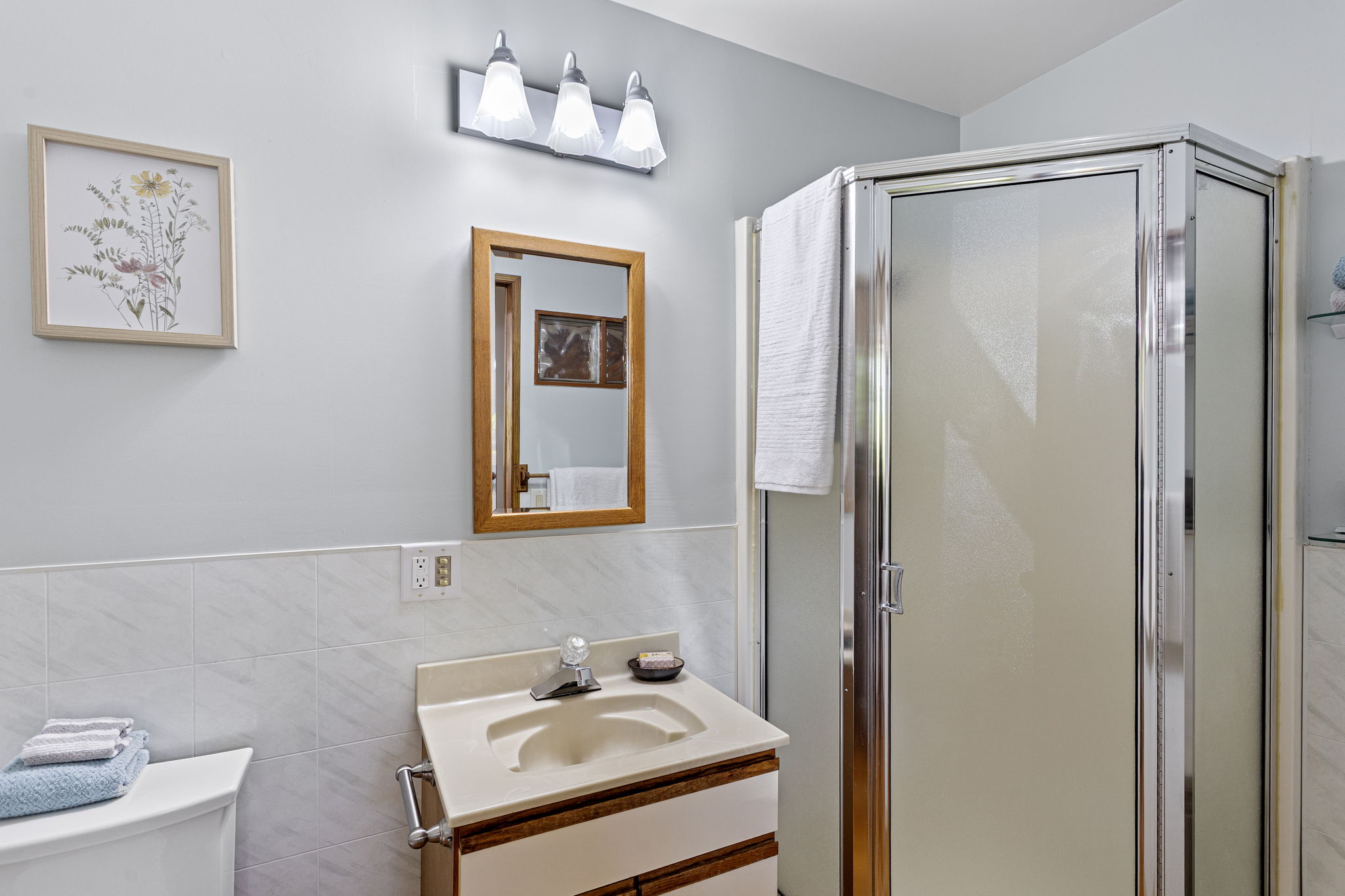 This private ¾ bath completes the lower-level primary suite—offering convenience and separation within a fully self-contained living space.