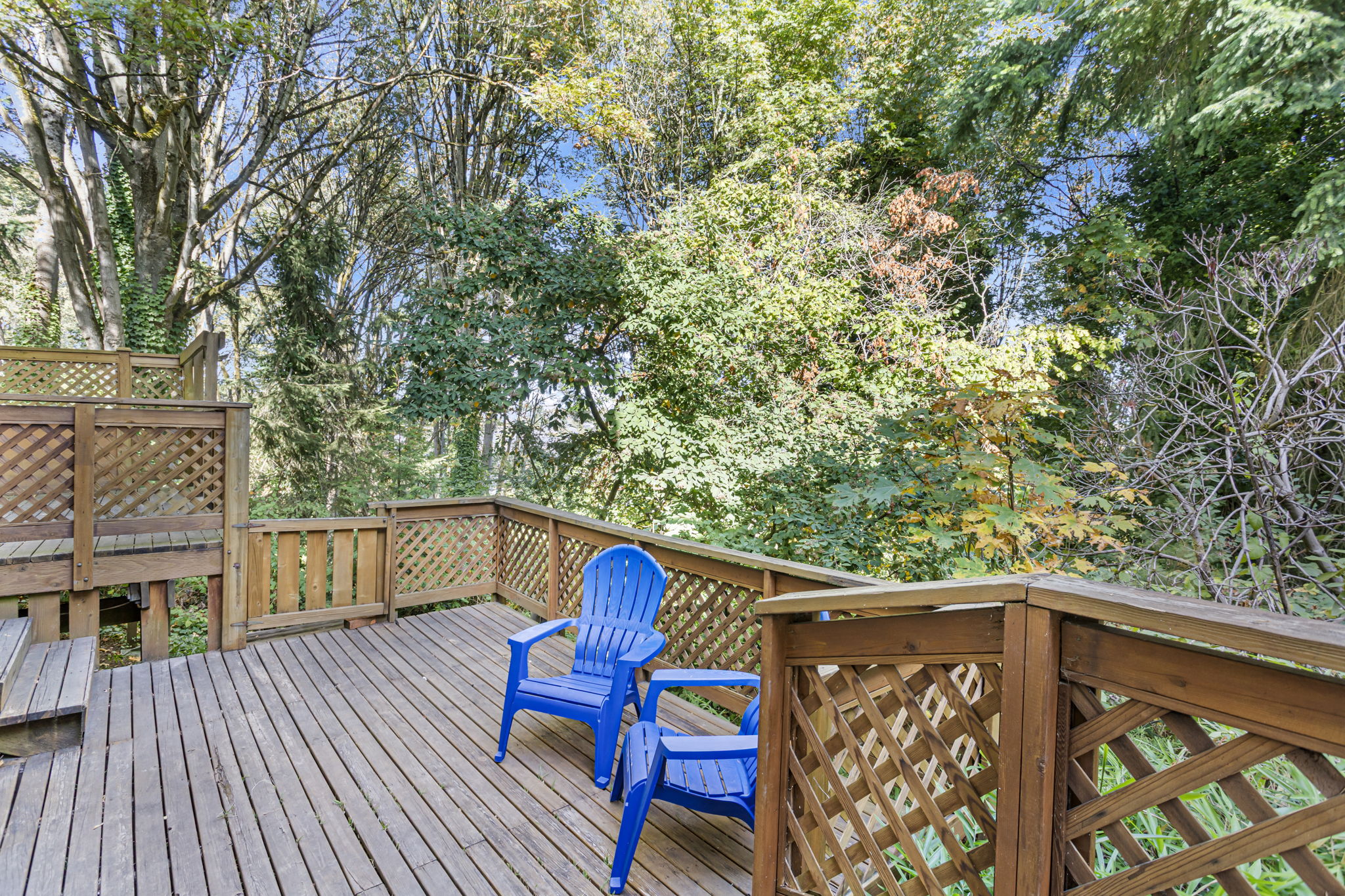 Two levels of deck space extend your living area into the trees—ideal for relaxing or entertaining in the forest-like surroundings. The lower deck leads directly to the basement’s laundry and utility zones.