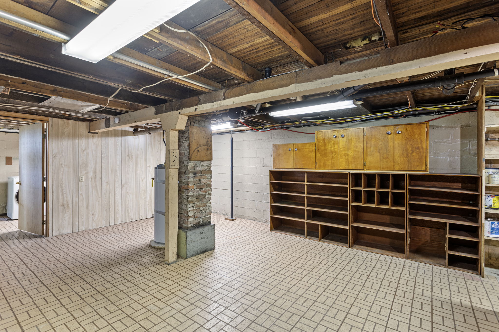 This unfinished area is equipped with custom cabinetry and open shelving—ideal for sorting tools, storing supplies, or staging your next home improvement project. A flexible space with serious function. 🔧 Bonus: A built-in workshop exhaust system is already in place. 📋 Home and sewer inspections (Sept. 2025) available upon request.