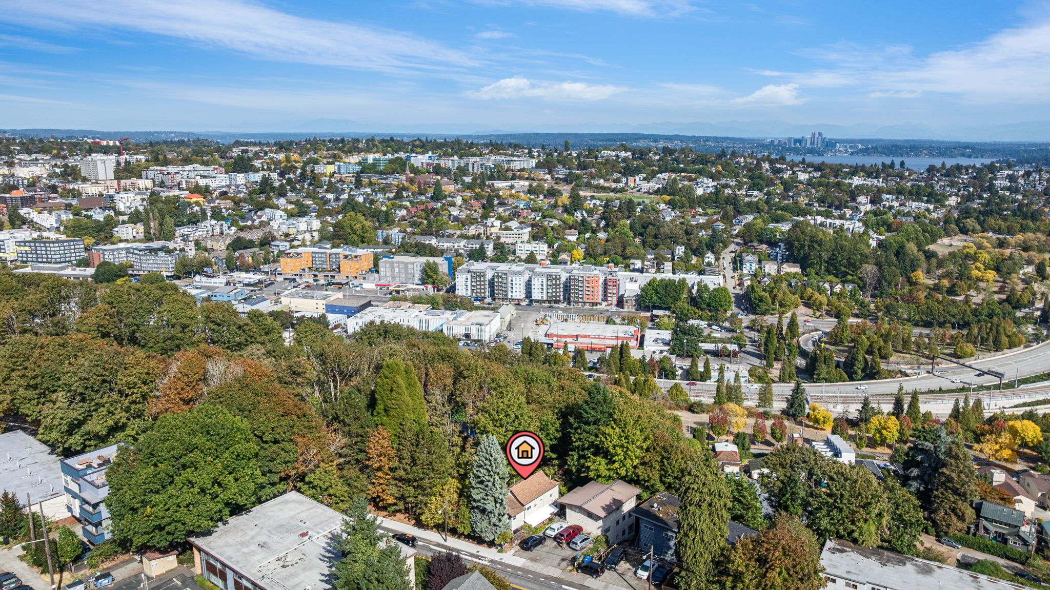 Urban Convenience Meets Forest Seclusion — Minutes from downtown and tucked beside the green expanse of Lewis Park, this North Beacon Hill home offers a rare blend of privacy and connectivity. Three levels, two living areas, and flexible spaces make it ideal for multigenerational living or future expansion.