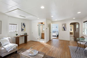 From the living area, an easy flow connects kitchen, bedroom, and bath—bright and practical, with room to breathe.