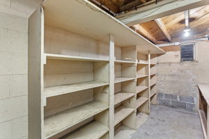 Wall-to-wall shelving and, just out of view, an extra-long workbench make this space ideal for tool organization, crafting, or project prep. Whether you're building, restoring, or simply storing—it’s ready to support what’s next.