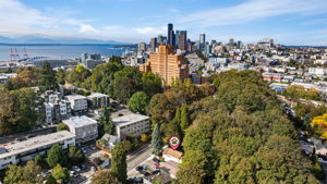 From Forest Edge to Skyline — This North Beacon Hill home offers rare privacy just minutes from downtown. Nestled beside Lewis Park and surrounded by trees, it spans three flexible levels with two distinct living areas and a shared basement. Walkable to Pacific Medical Centers, close to light rail and major bus lines, and fronted by a protected bike lane—perfect for commuting by bike, scooter, or e-bike. A rooted home in a connected, evolving neighborhood—private, practical, and ready to grow with you. Urban Convenience Meets Forest Seclusion