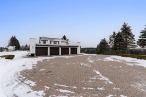 DrivePaved stone driveway in front of Garages