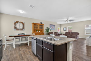 Kitchen Island features a new Kohler Guild Pull-down Kitchen Sink Faucet with Three-function Sprayhead