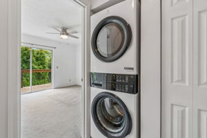 Landing/Laundry Closet/Entrance to Primary Bedroom