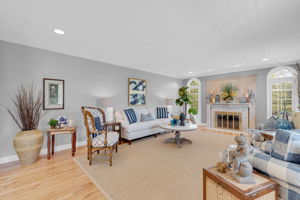 Great Room with Recessed Lighting, Crown Molding, wood Floors and Gas Fireplace