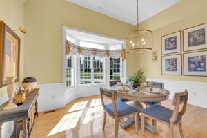 Formal Dining with Bay Windows, Tall Ceiling, Elegant Molding and wood Floors