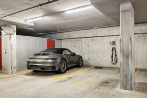 Two side by side parking spaces with EV