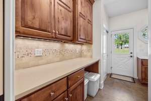 Mud room/butler pantry with storage closet