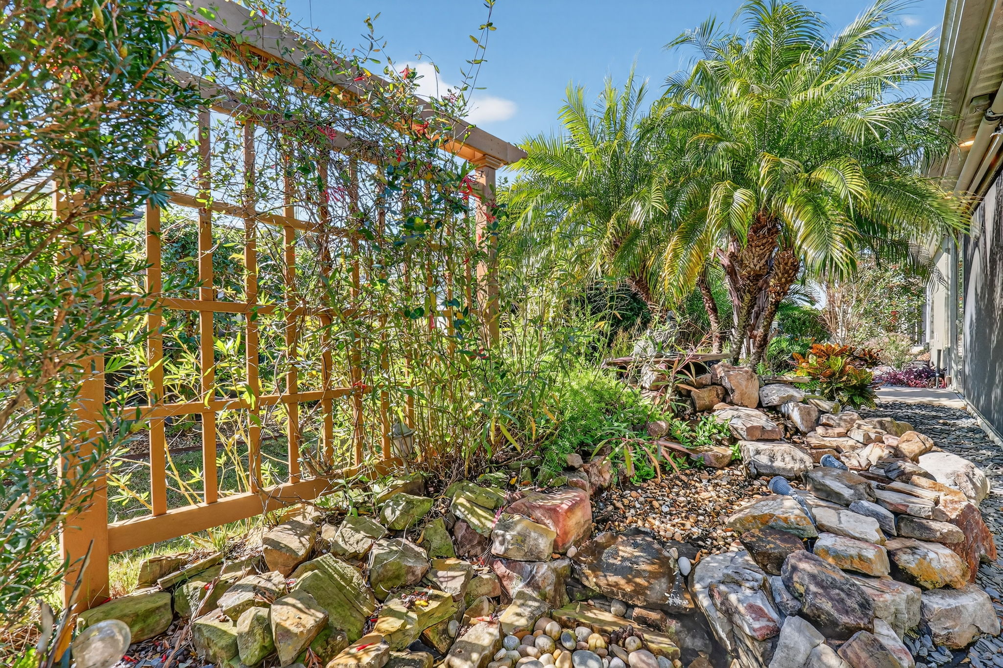 Rear Rock Garden with Waterfall and Privacy Trellis