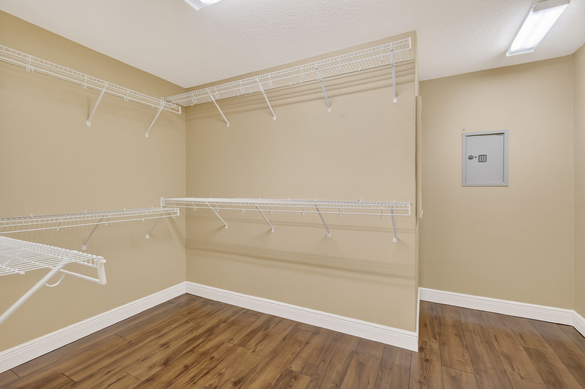 Primary Bedroom Walk-In Closet with Built-In Safe
