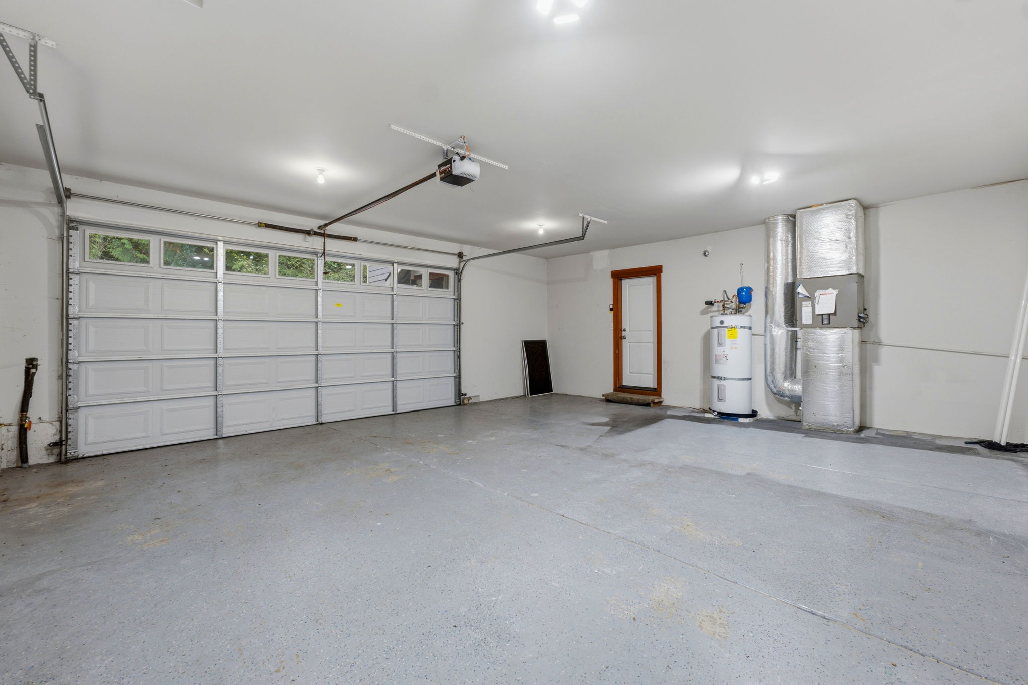 2-car garage with space for shelving and storage