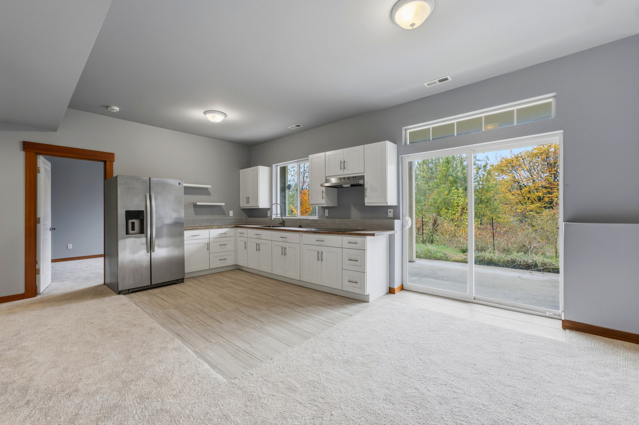 2nd kitchen, downstairs; view patio to the right