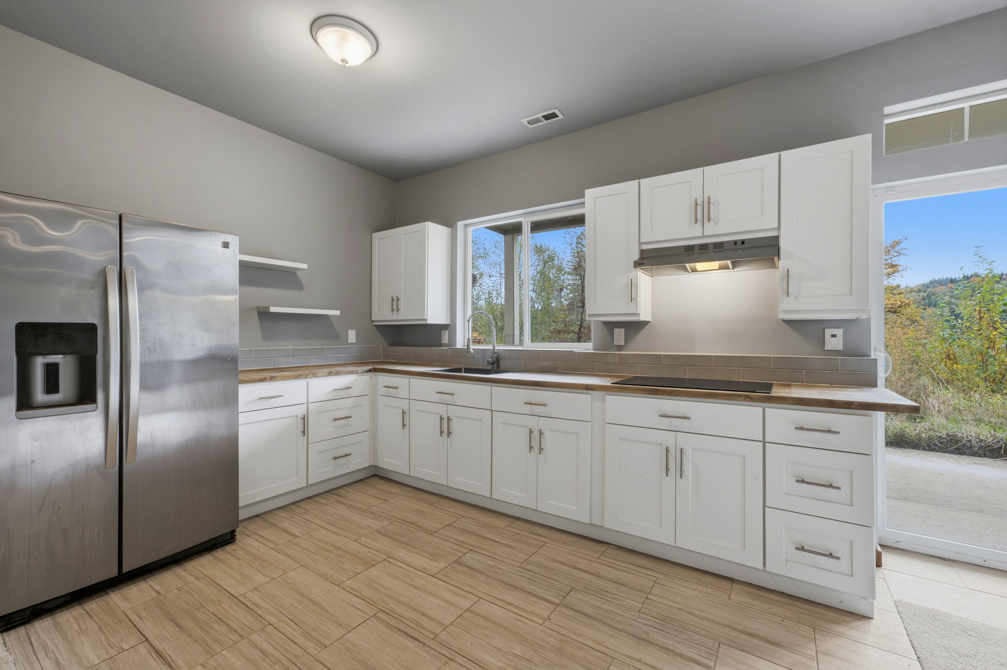 2nd kitchen, downstairs; tile floor, butcher block counters
