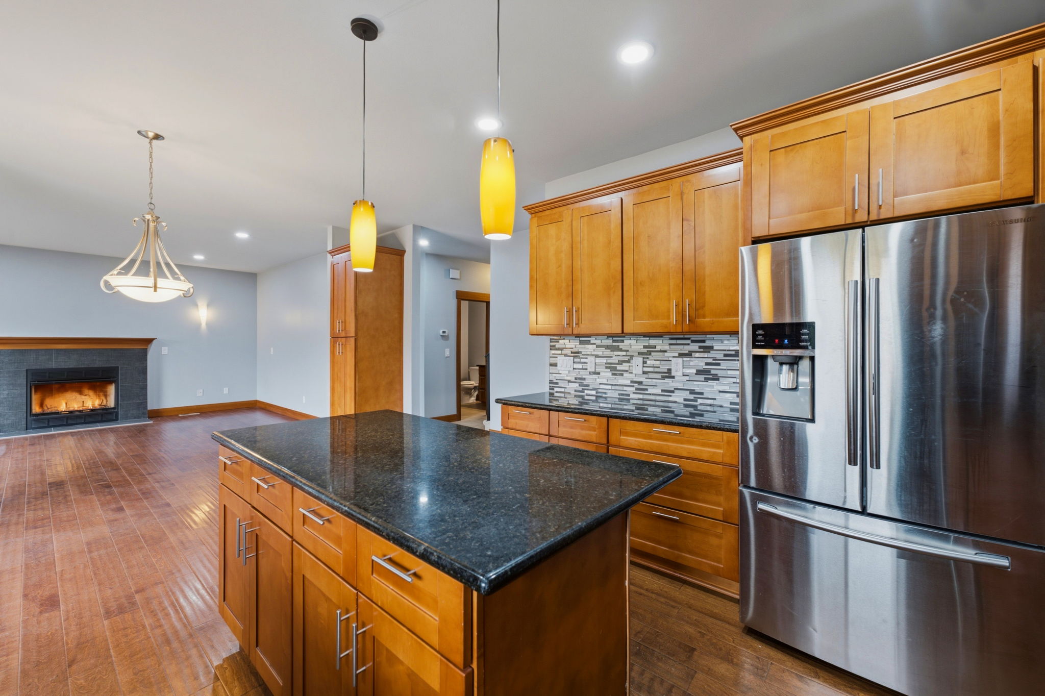 Main level kitchen with guest bathroom in the background