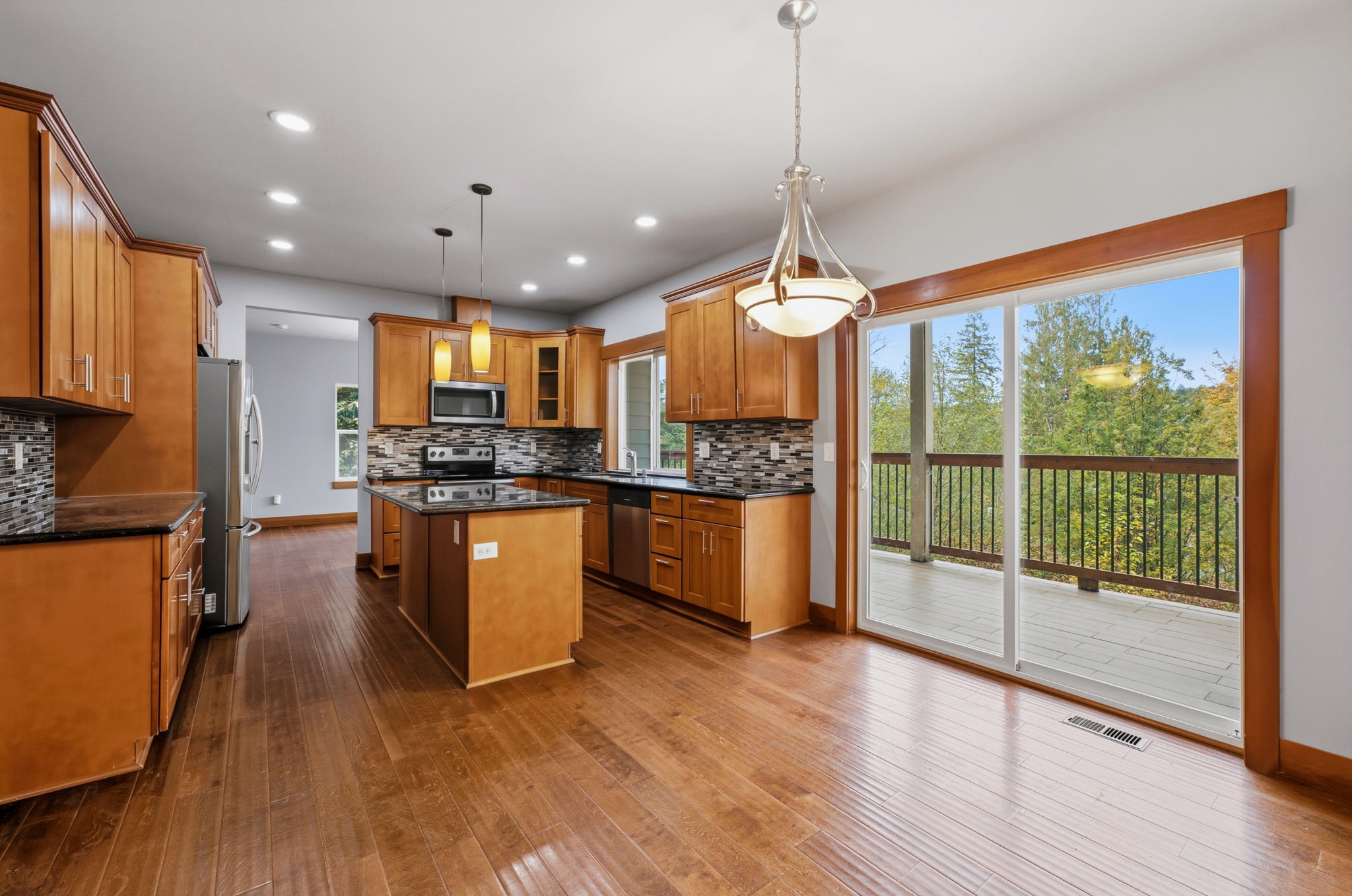 Main level kitchen, access to tiled deck to the right