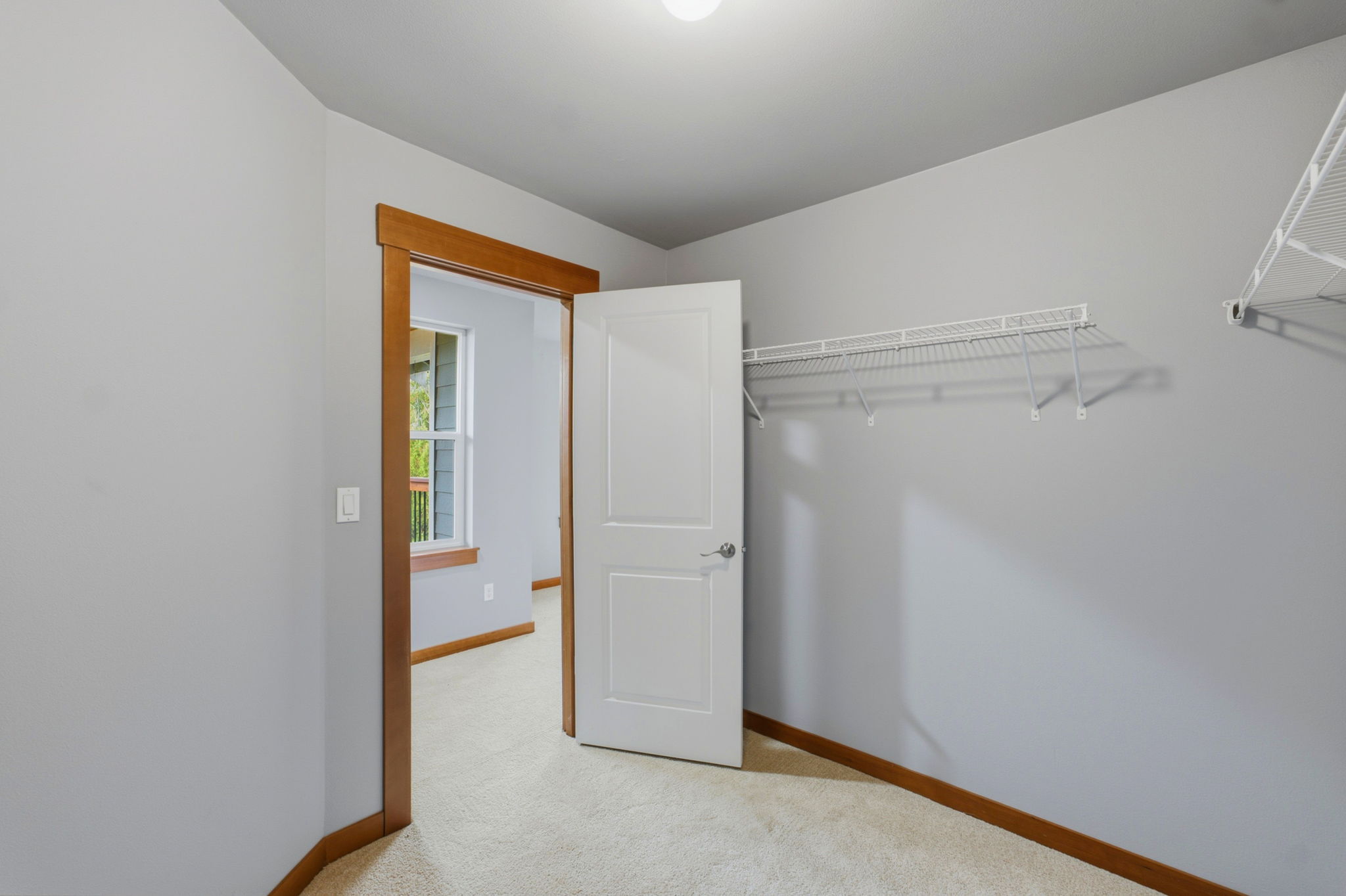 Upstairs primary bedroom walk in closet