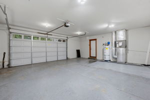 2-car garage with space for shelving and storage
