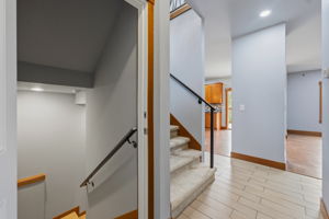 Main level stair access to both upstairs and downstairs