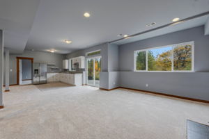 2nd Living Room looking into 2nd kitchen and extra large 2nd Primary bedroom beyond that