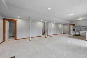2nd Living room looking at large closet, stairs to the main level, 2nd kitchen