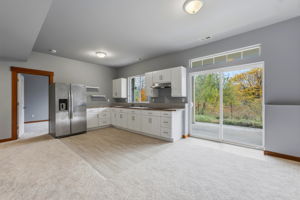 2nd kitchen, downstairs; view patio to the right
