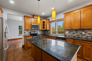 Main level kitchen with dining room off to the left