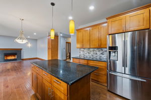 Main level kitchen with guest bathroom in the background