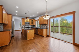 Main level kitchen, access to tiled deck to the right