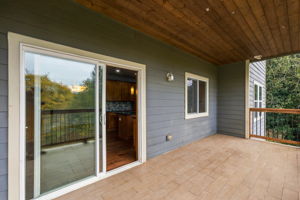 Main level tiled deck looking into the kitchen