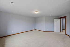 Upstairs primary bedroom looking out to the hallway