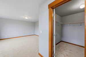 Upstairs primary bedroom walk in closet