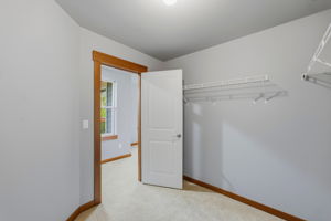 Upstairs primary bedroom walk in closet