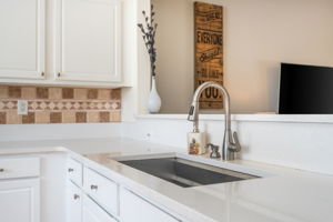 Quartz Counters, Upgraded Sink and perfect Natural Lighting.